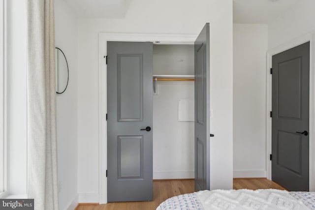 1007 Bryant St NE Unit 3, Washington, DC 20018 - bedroom featuring wood finished floors, a closet, and baseboards