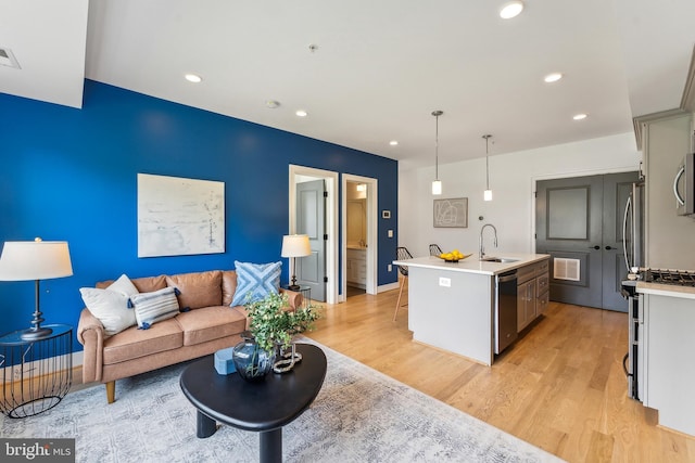1007 Bryant St NE Unit 3, Washington, DC 20018 - living area with light wood finished floors, recessed lighting, and baseboards