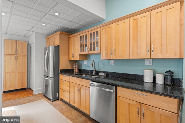 1205 G St NE, Washington, DC 20002 - kitchen featuring stainless steel appliances, a sink, recessed lighting, glass insert cabinets, and dark stone counters