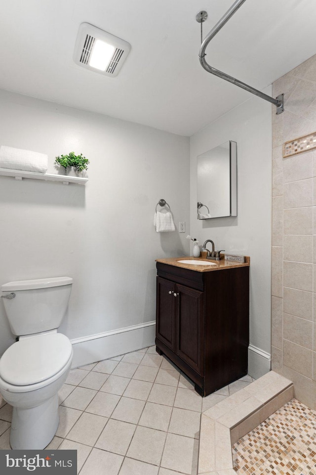 1205 G St NE, Washington, DC 20002 - full bathroom featuring tile patterned floors, toilet, vanity, and a tile shower