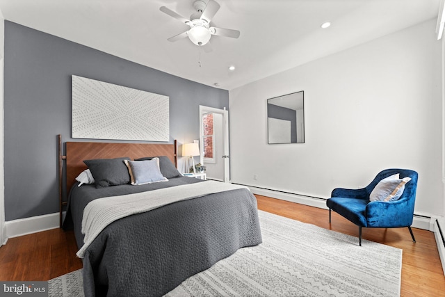 1205 G St NE, Washington, DC 20002 - bedroom featuring baseboard heating, wood finished floors, baseboards, recessed lighting, and ceiling fan