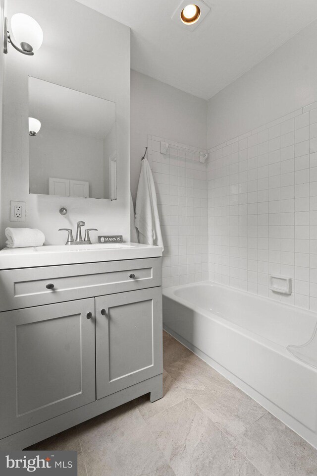 1205 G St NE, Washington, DC 20002 - bathroom featuring vanity and shower / washtub combination