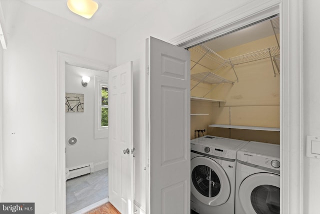 1205 G St NE, Washington, DC 20002 - laundry area featuring a baseboard radiator, independent washer and dryer, and light wood finished floors