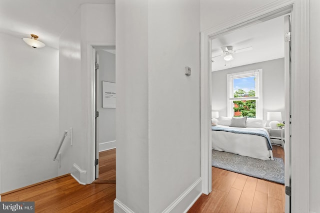 1205 G St NE, Washington, DC 20002 - hallway with an upstairs landing, wood finished floors, baseboards, and a baseboard radiator