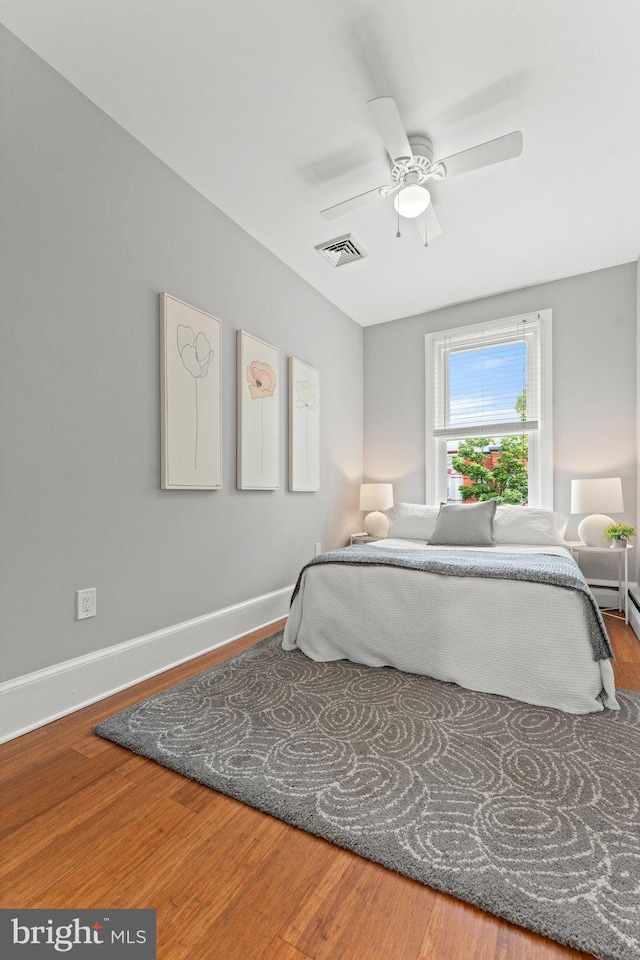 1205 G St NE, Washington, DC 20002 - bedroom featuring wood finished floors, baseboards, and ceiling fan
