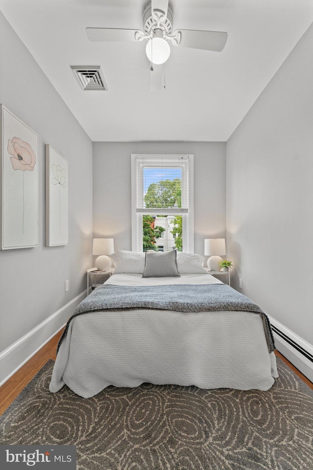 1205 G St NE, Washington, DC 20002 - bedroom featuring wood finished floors, ceiling fan, and baseboards