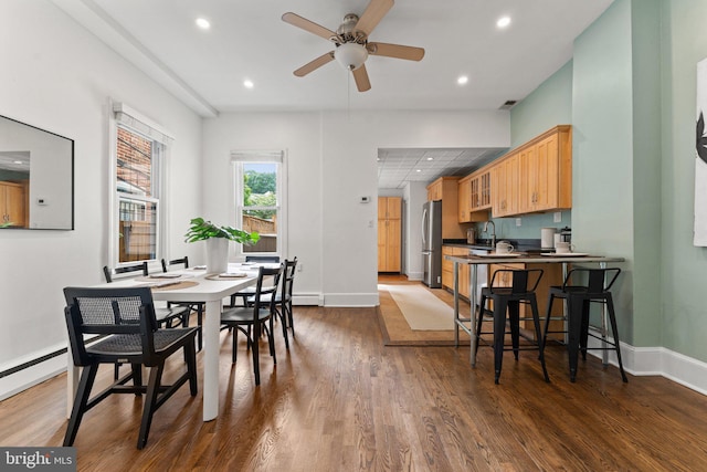1205 G St NE, Washington, DC 20002 - dining space featuring dark wood finished floors, ceiling fan, recessed lighting, baseboards, and a baseboard heating unit