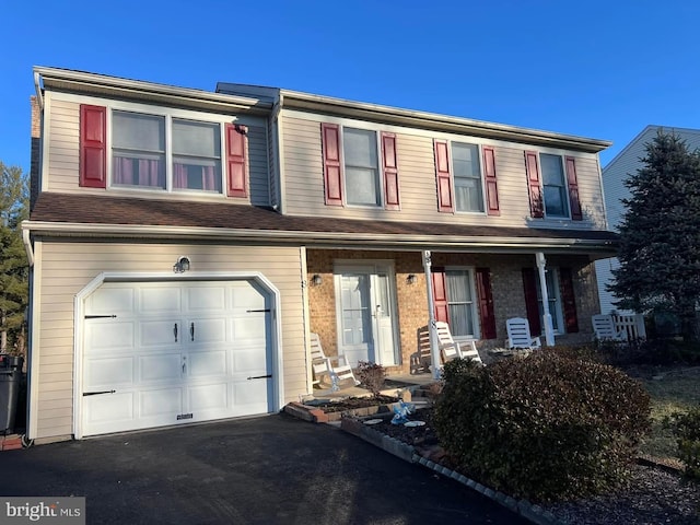 8 Steve Way, Baltimore, MD 21236 - townhome / multi-family property featuring a garage, a porch, and driveway