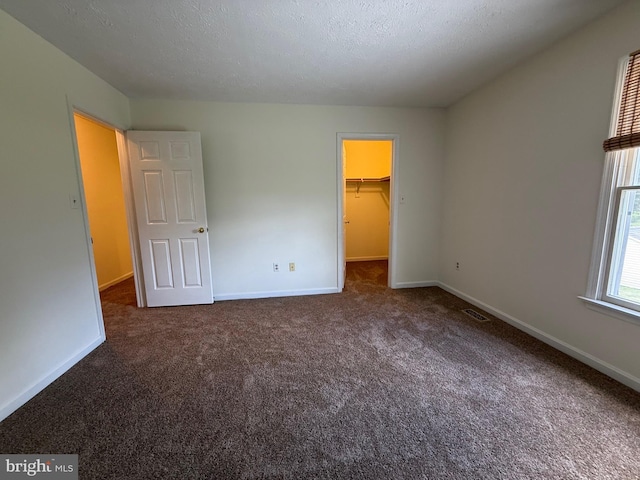 8 Steve Way, Baltimore, MD 21236 - unfurnished bedroom with carpet flooring, baseboards, a walk in closet, and a closet