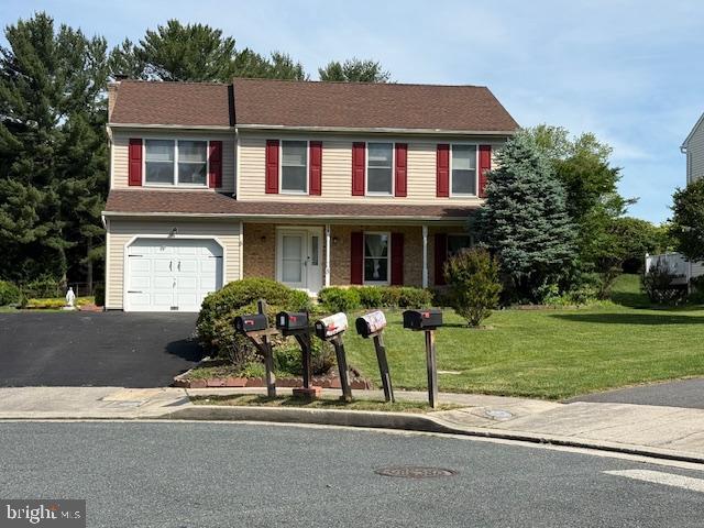 8 Steve Way, Baltimore, MD 21236 - view of front of property featuring a garage, a front lawn, driveway, and covered porch