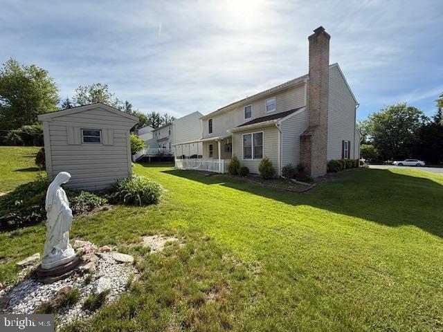 8 Steve Way, Baltimore, MD 21236 - rear view of property with a yard and a chimney