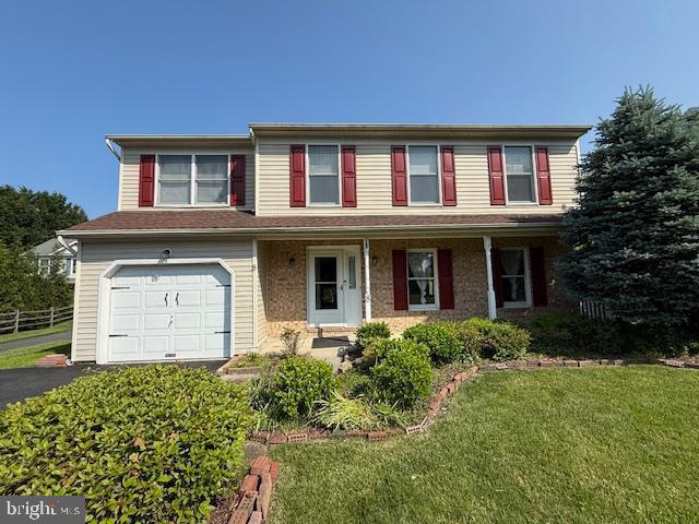 8 Steve Way, Baltimore, MD 21236 - traditional-style house with an attached garage, driveway, and covered porch