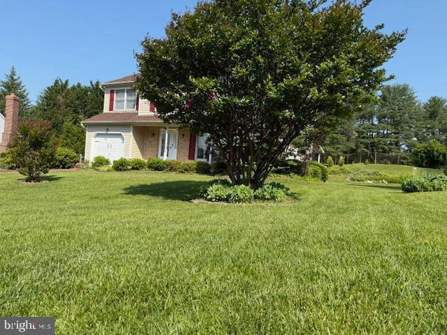 8 Steve Way, Baltimore, MD 21236 - view of grassy yard featuring a garage