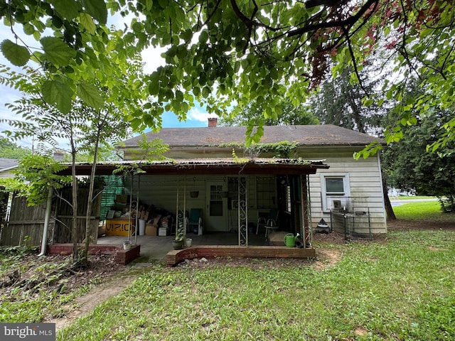 386 Round Hill Rd, Winchester, VA 22602 - back of house with a patio area, a chimney, a yard, and cooling unit