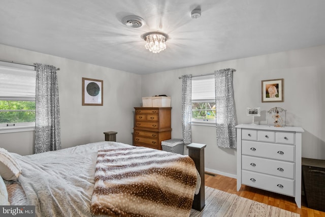 1980 State Route 72 N, Lebanon, PA 17046 - bedroom with multiple windows, wood finished floors, a chandelier, and baseboards