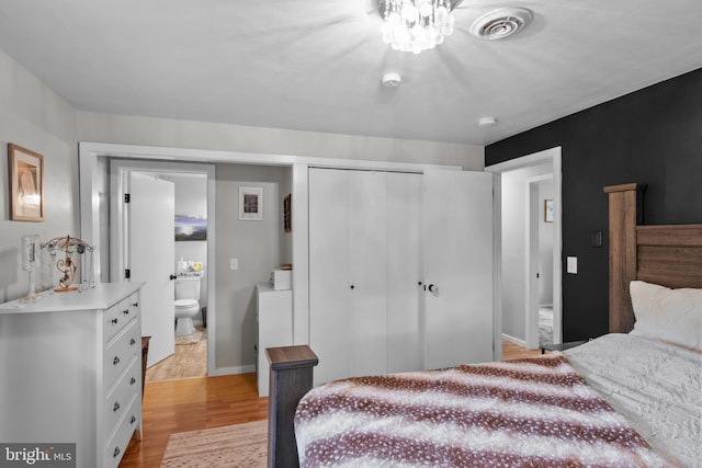 1980 State Route 72 N, Lebanon, PA 17046 - bedroom with light wood finished floors, a closet, ensuite bath, and baseboards