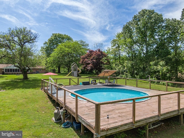 1980 State Route 72 N, Lebanon, PA 17046 - view of pool featuring a wooden deck, a lawn, and view of wooded area