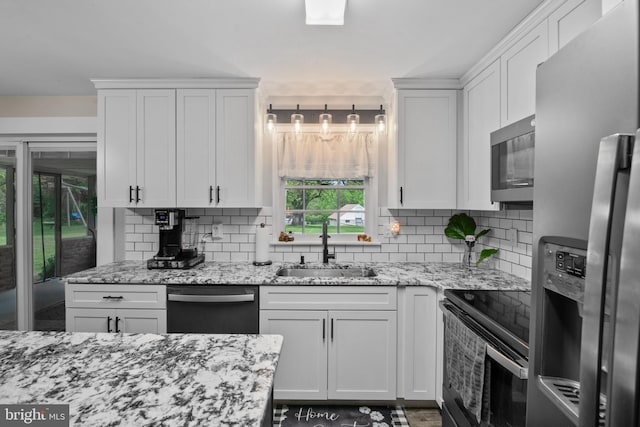 1980 State Route 72 N, Lebanon, PA 17046 - kitchen with appliances with stainless steel finishes, a sink, backsplash, and white cabinets