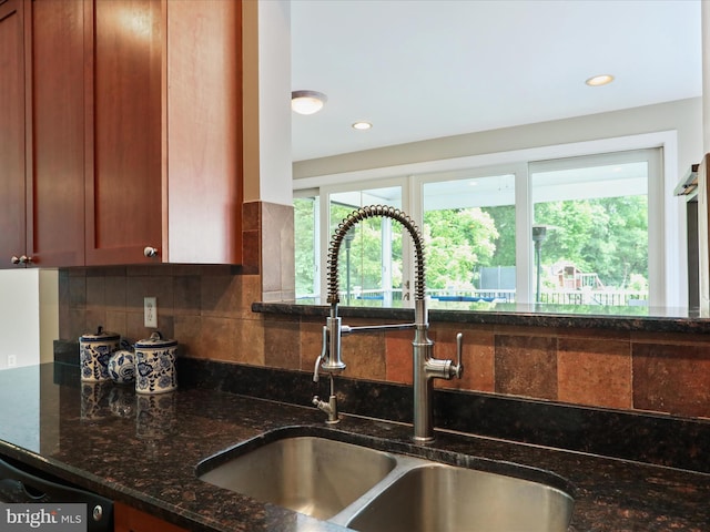 40 Inaugural Way, Charles Town, WV 25414 - kitchen featuring a sink, tasteful backsplash, dark stone counters, healthy amount of natural light, and recessed lighting