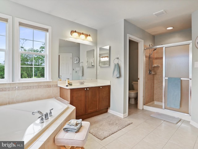 40 Inaugural Way, Charles Town, WV 25414 - full bath featuring a bath, vanity, a shower stall, toilet, and tile patterned floors