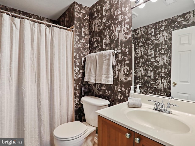 40 Inaugural Way, Charles Town, WV 25414 - bathroom with wallpapered walls, toilet, vanity, and a shower with curtain