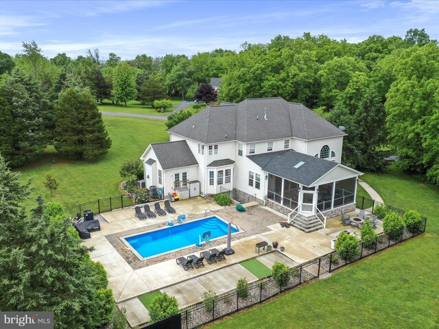 40 Inaugural Way, Charles Town, WV 25414 - back of house featuring a sunroom, a shingled roof, and a patio area