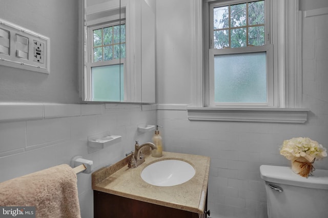 530 Gregg St, Shillington, PA 19607 - bathroom with vanity, toilet, tile walls, and a wainscoted wall