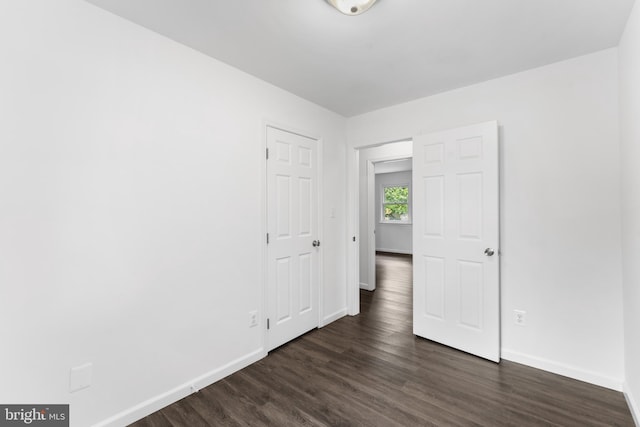 304 Montfield Ln, Glen Burnie, MD 21061 - spare room featuring baseboards and dark wood finished floors