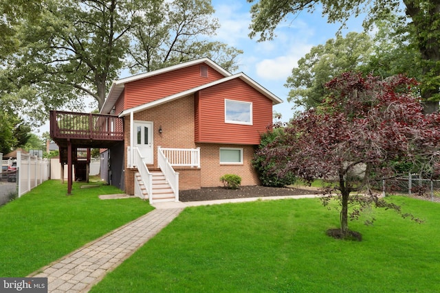 304 Montfield Ln, Glen Burnie, MD 21061 - view of front facade with a wooden deck, brick siding, and stairway