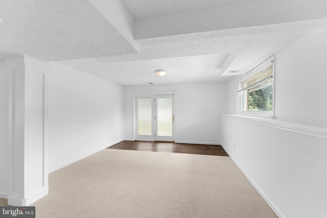 304 Montfield Ln, Glen Burnie, MD 21061 - spare room with dark colored carpet, a textured ceiling, and baseboards
