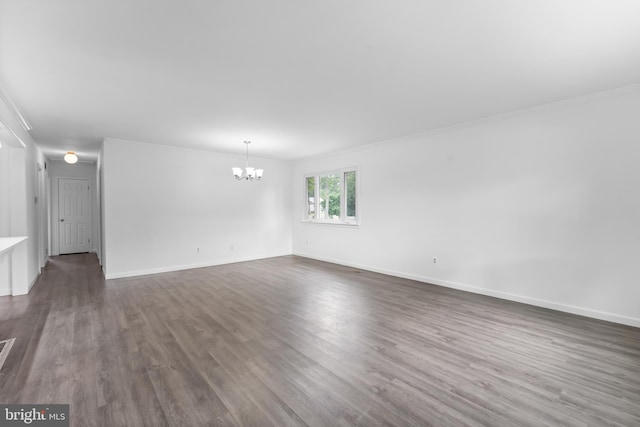 304 Montfield Ln, Glen Burnie, MD 21061 - spare room with a chandelier, dark wood finished floors, baseboards, and crown molding