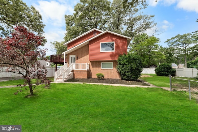 304 Montfield Ln, Glen Burnie, MD 21061 - view of front of house featuring brick siding, a wooden deck, and stairway