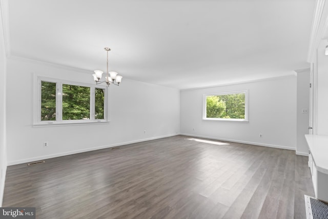 304 Montfield Ln, Glen Burnie, MD 21061 - spare room with a chandelier, wood finished floors, baseboards, and ornamental molding