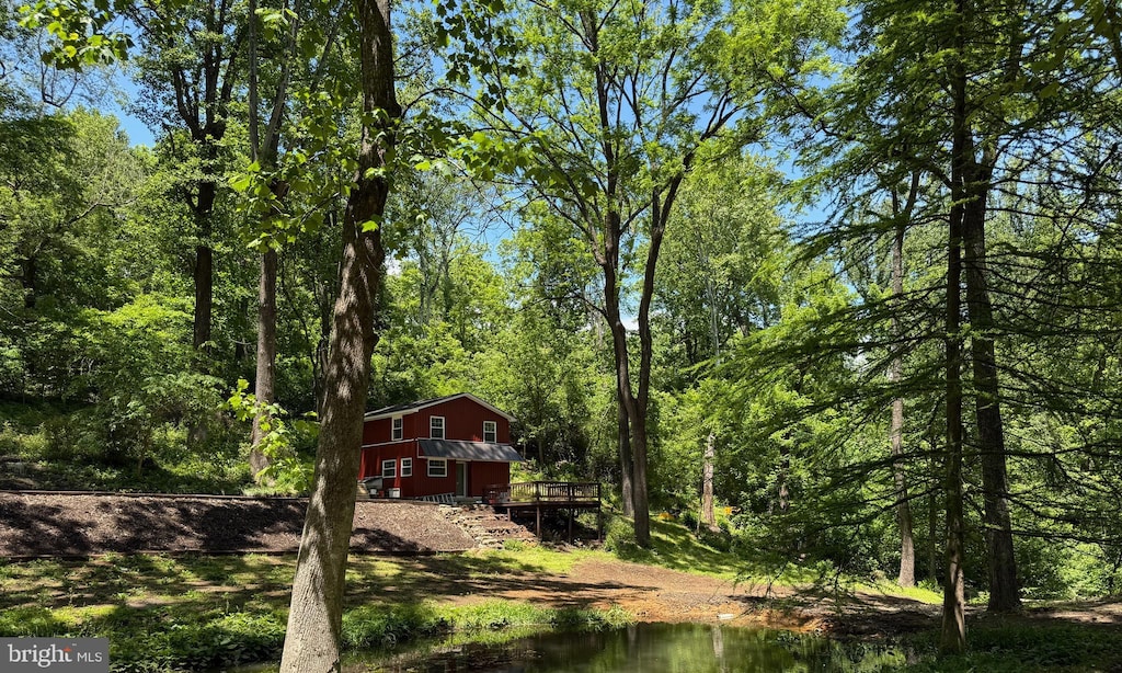 18 Bolton Branch Ln, Huntly, VA 22640 - view of yard with a deck, a view of trees, and stairs