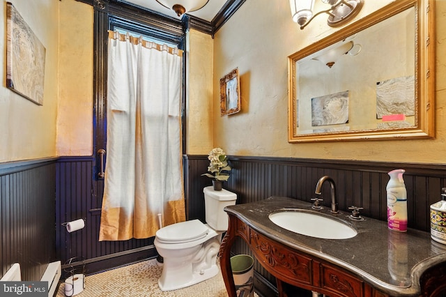 706 Locust St, Cambridge, MD 21613 - bathroom with a wainscoted wall, vanity, toilet, tile patterned flooring, and a baseboard heating unit