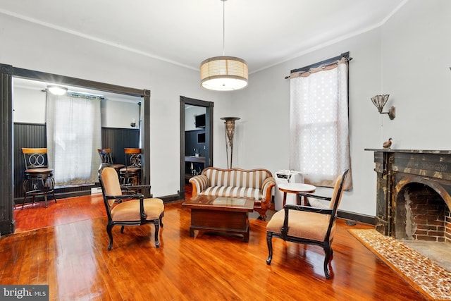 706 Locust St, Cambridge, MD 21613 - living area featuring wood finished floors, a fireplace with flush hearth, and baseboards