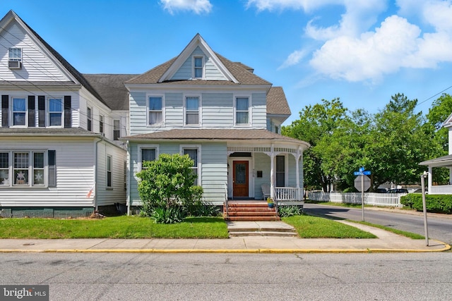 706 Locust St, Cambridge, MD 21613 - view of front facade with a porch and a shingled roof