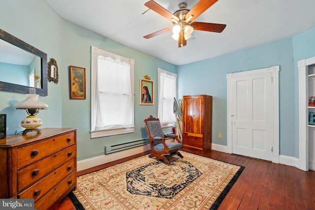 706 Locust St, Cambridge, MD 21613 - sitting room featuring a baseboard radiator, wood-type flooring, ceiling fan, and baseboards