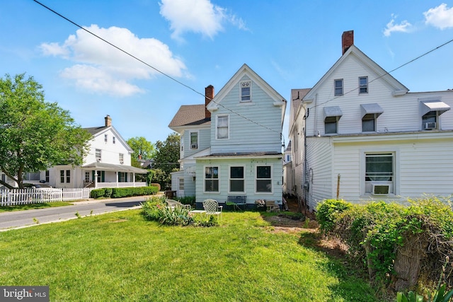 706 Locust St, Cambridge, MD 21613 - rear view of house featuring a chimney