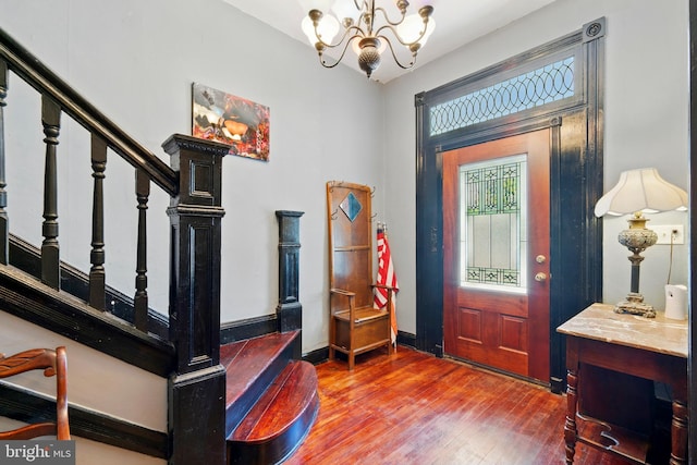 706 Locust St, Cambridge, MD 21613 - entryway featuring hardwood / wood-style flooring, a chandelier, and stairs