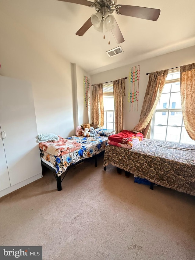 7636 Tall Pin Oak Dr Unit 111, Elkridge, MD 21075 - bedroom featuring carpet floors, multiple windows, and a ceiling fan