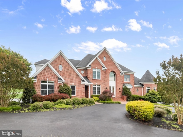 6419 Homebuilder Dr, Mount Airy, MD 21771 - georgian-style home featuring brick siding and asphalt driveway