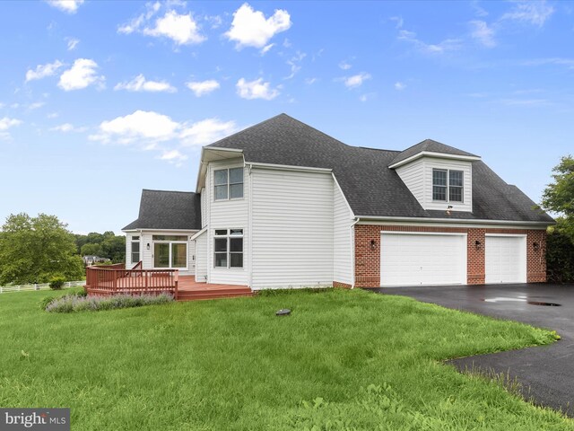 6419 Homebuilder Dr, Mount Airy, MD 21771 - back of house with driveway, a wooden deck, a lawn, a garage, and a shingled roof