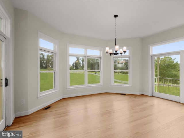 6419 Homebuilder Dr, Mount Airy, MD 21771 - unfurnished dining area with plenty of natural light, a chandelier, and light wood finished floors