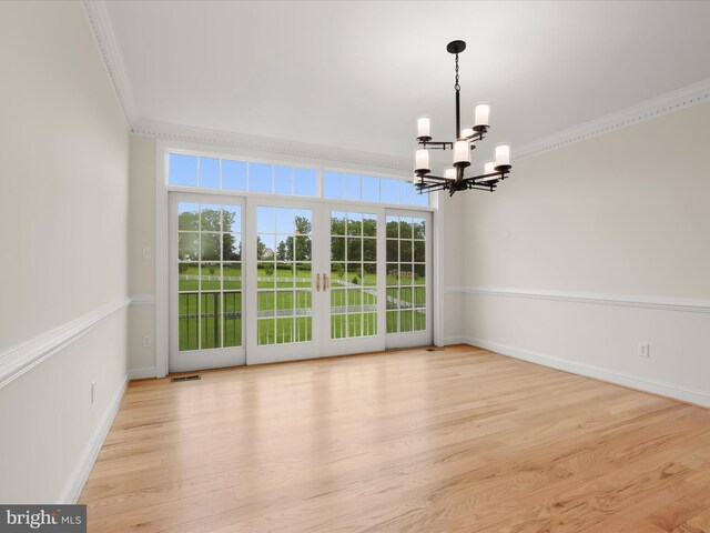 6419 Homebuilder Dr, Mount Airy, MD 21771 - empty room with crown molding, a chandelier, baseboards, and wood finished floors