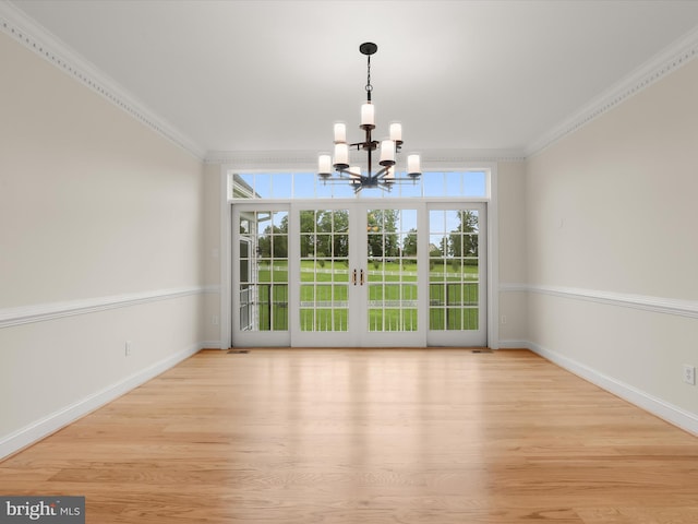 6419 Homebuilder Dr, Mount Airy, MD 21771 - unfurnished dining area with a chandelier, wood finished floors, plenty of natural light, crown molding, and baseboards
