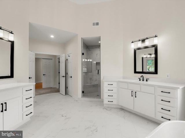 6419 Homebuilder Dr, Mount Airy, MD 21771 - full bath with a stall shower, marble finish floors, two vanities, a soaking tub, and a towering ceiling