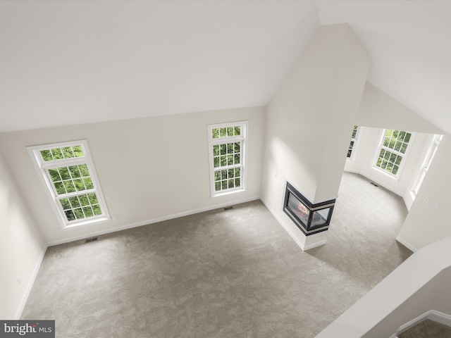 6419 Homebuilder Dr, Mount Airy, MD 21771 - unfurnished living room with carpet floors, vaulted ceiling, healthy amount of natural light, and baseboards