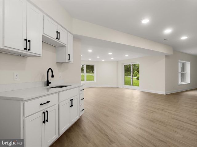6419 Homebuilder Dr, Mount Airy, MD 21771 - kitchen with a sink, open floor plan, light wood-type flooring, recessed lighting, and white cabinets