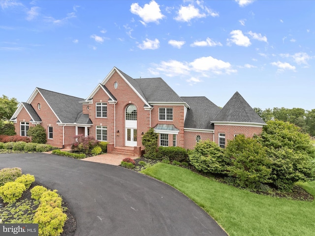 6419 Homebuilder Dr, Mount Airy, MD 21771 - view of front of property featuring brick siding, a front yard, and french doors